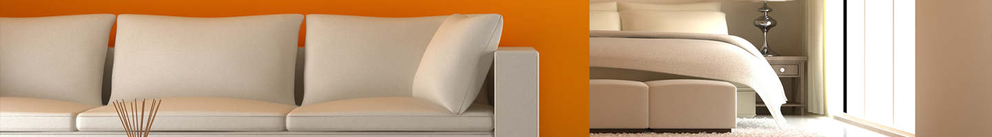 sofa en pared naranja y cama de fondo 